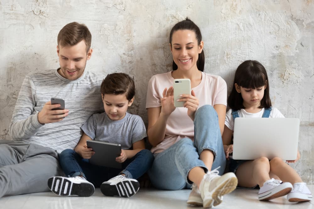 A family using their mobile phones